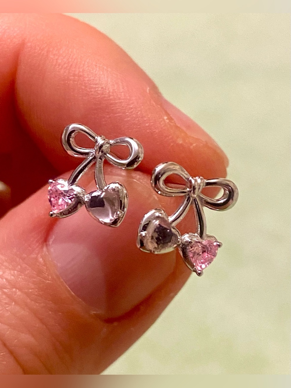 Silver Bow Cherry Stud Earrings with Pink Gem Accents